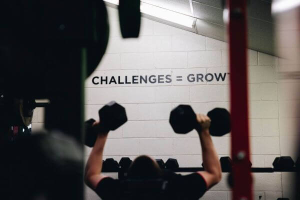 player doing dumbbell bench press